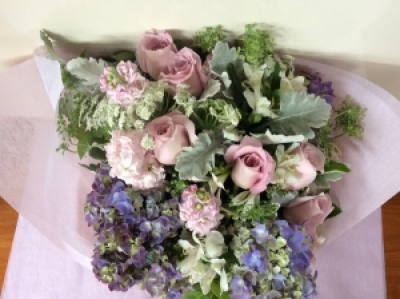 sweetness - A selection of roses , silver suede leaves , hydrangeas in mauve colours with a touch of white