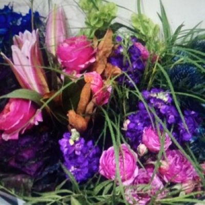 Iconic  - A seasonal selection of beautiful shades of blue, pinks and purples with an accent of lime green and a more of foliage arranged and presented in a bouquet.